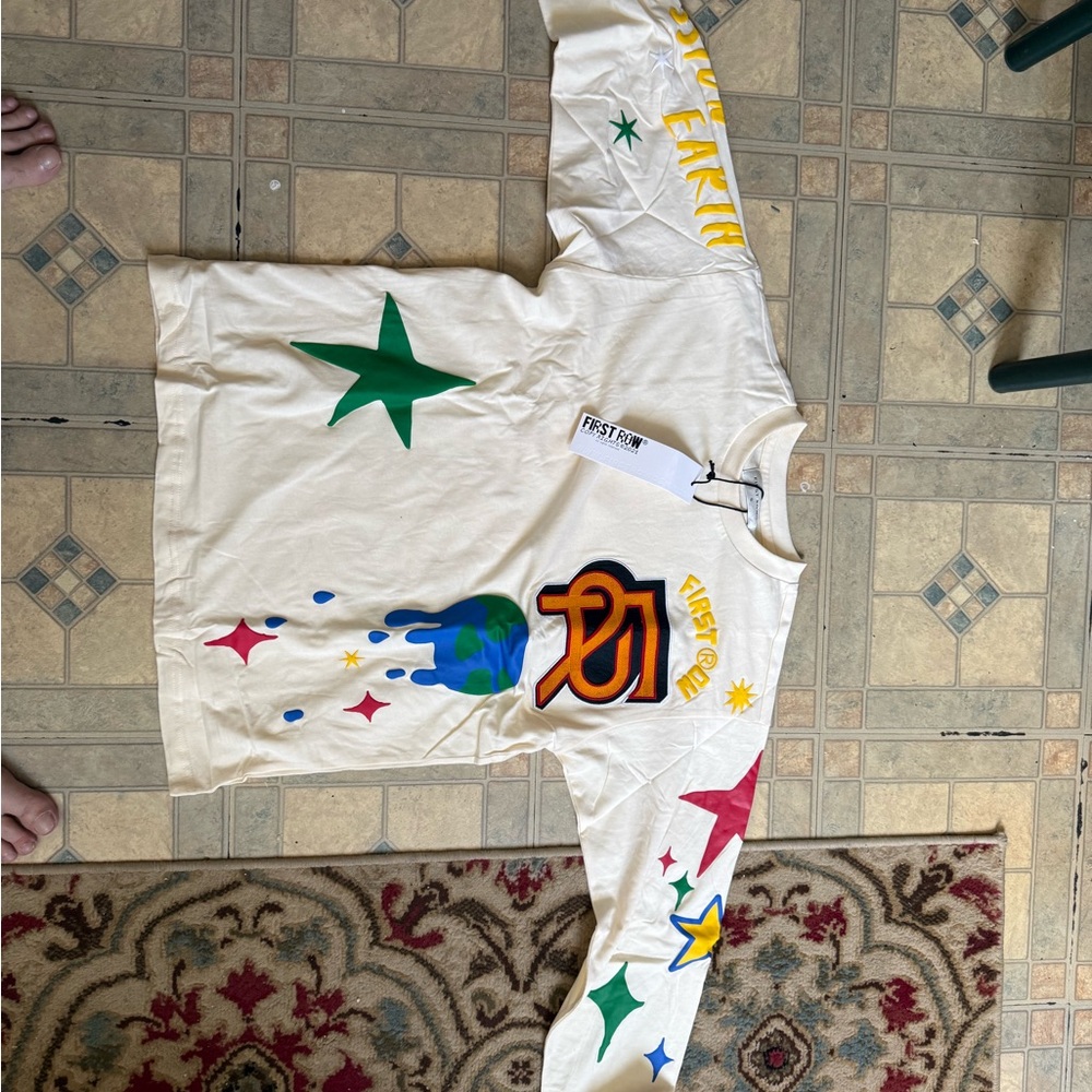 Vibrant Cream Long Sleeve Tee with Multicolor Graphics